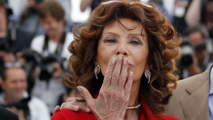 File photo of actress Sophia Loren blowing a kiss as she poses during a photocall for the film 'La voce umana' presented as part of Cannes Classics at in competition at the 67th Cannes Film Festival in Cannes