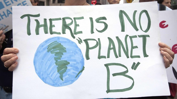 A protester carries a sign during the 'People's Climate March' in the Manhattan borough of New York