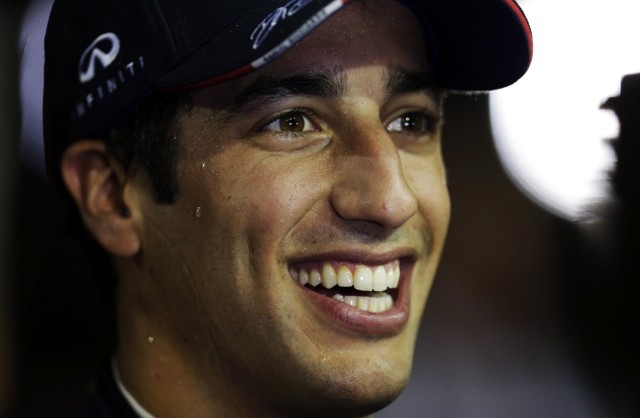 Red Bull Formula One driver Ricciardo of Australia smiles as he talks to journalist after the qualifying session at the Singapore F1 Grand Prix at the Marina Bay street circuit in Singapore