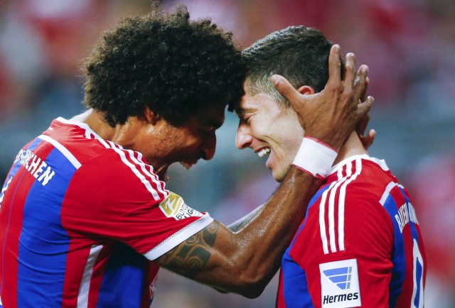 Bayern Munich's Lewandowski and Dante celebrate a goal against Paderborn during their German first division Bundesliga soccer match in Munich