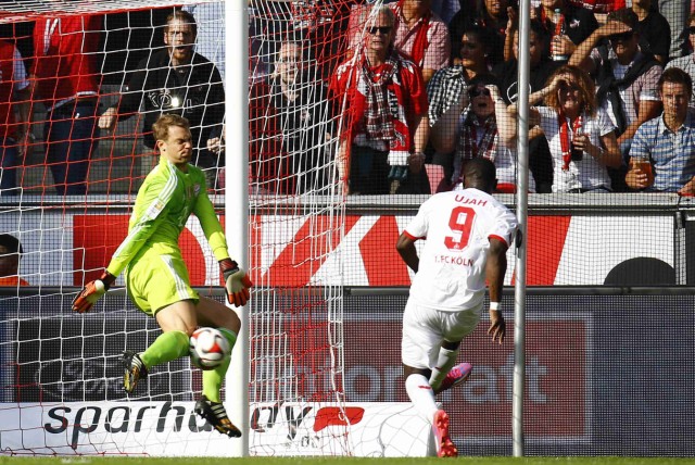 Bayern Munich's Manuel Neuer saves a ball from Anthony Ujah of FC Cologne during their German first division Bundesliga soccer match in Cologne