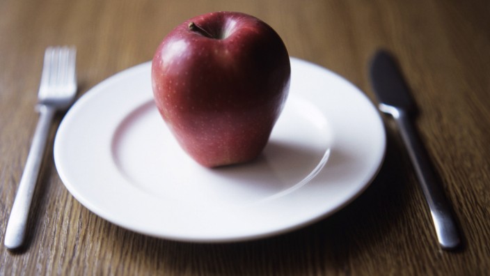 Apple on plate Apple on a plate This image could be used to depict healthy eating or dieting PUBLI