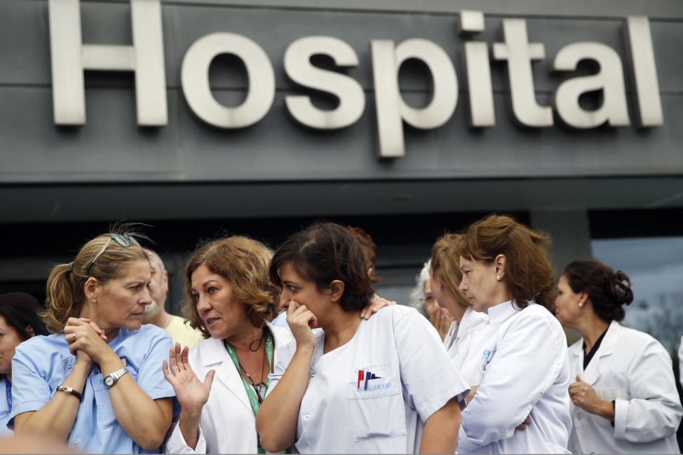 Health workers attend a protest outside La Paz Hospital calling for Spain's Health Minister Ana Mato to resign after a Spanish nurse contracted Ebola, in Madrid