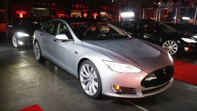 New all-wheel-drive versions of the Tesla Model S car are lined up for test drives in Hawthorne, California