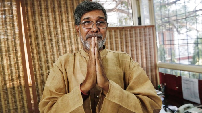 Indian children's right activist Satyarthi gestures as he speaks with the media at his office in New Delhi