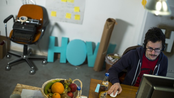 Contini of Italy works in the office of the HowDo start-up at the Wostel co-working space in Berlin