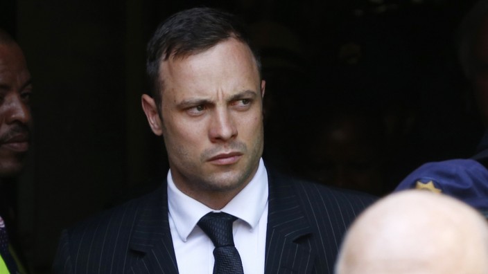 South African Olympic and Paralympic sprinter Oscar Pistorius leaves the North Gauteng High Court in Pretoria