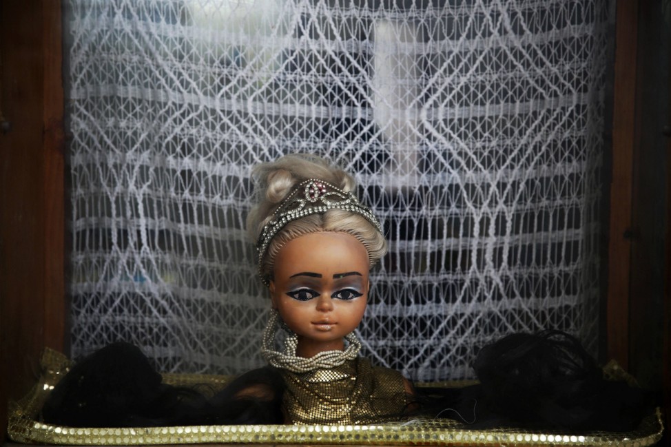 A head of a mannequin decorates a hair salon in Rabat's Medina