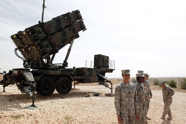 U.S. soldiers stand beside a U.S. Patriot missile system at a Turkish military base in Gaziantep, southeastern Turkey