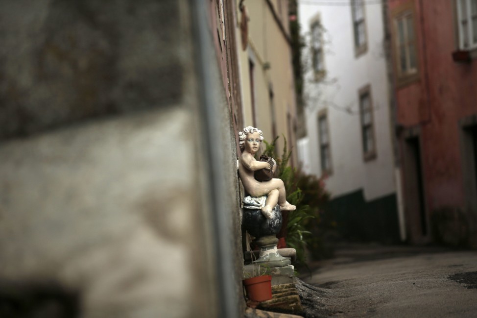 A figure decorates a street in downtown Sintra