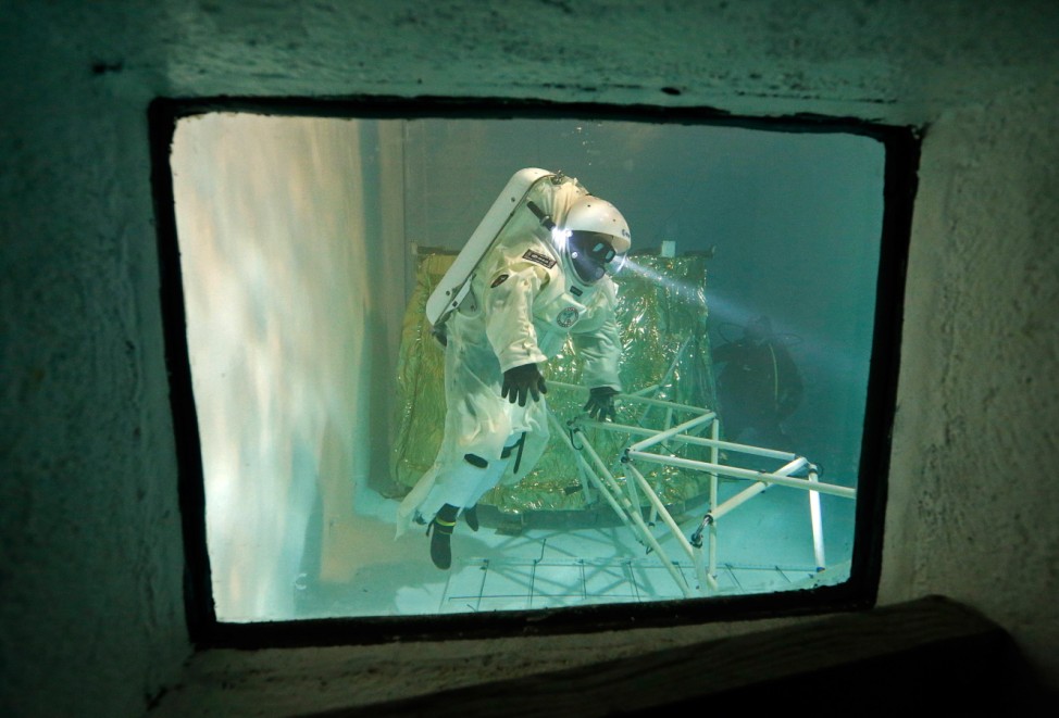 National Diving School director Vincent ,wearing a Gandolfi space suit, trains in a swimming pool in Marseille