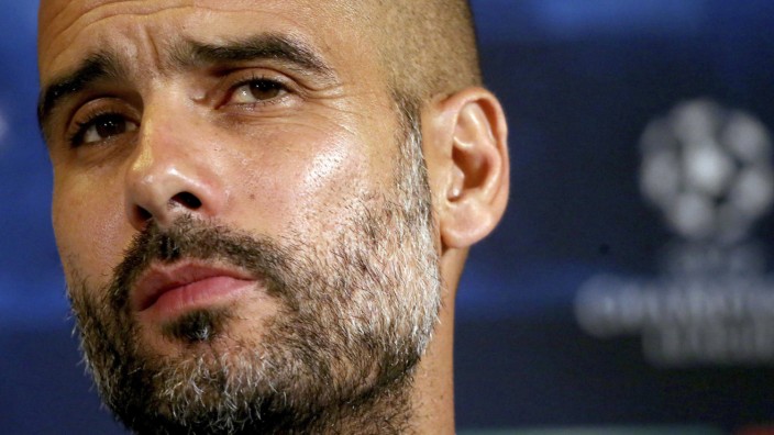 Bayern Munich's coach Pep Guardiola attends a news conference on the eve of their Champions League match against AS Roma at the Olympic stadium in Rome