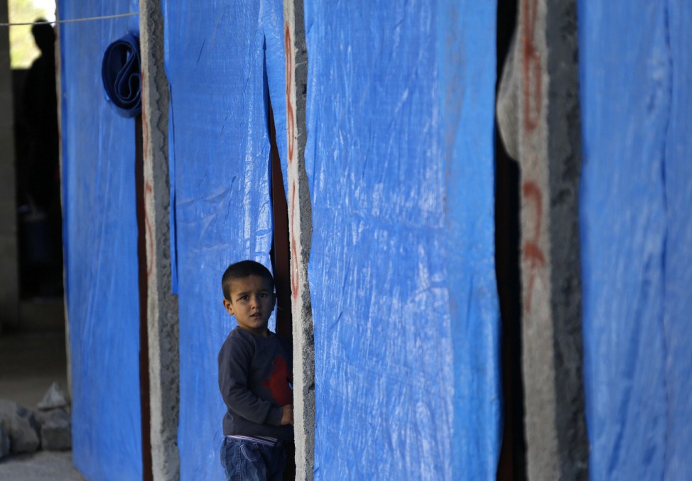 Kurdish refugee from Kobani is seen at a refugee camp in Suruc