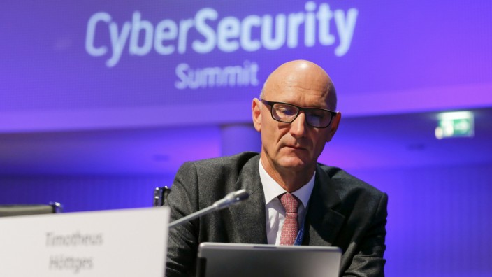 Hoettges, CEO of Germany's telecommunications giant Deutsche Telekom AG uses his tablet computer at the CyberSecurity summit in Bonn