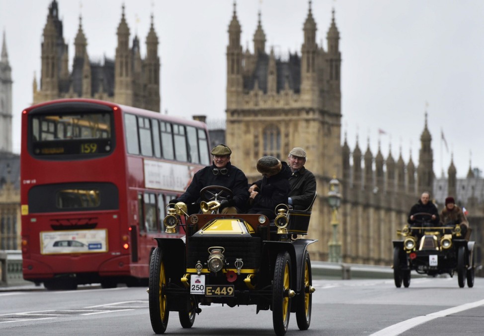 Motorists cross Westminster Bridge as they participate in the annual London to Brighton Veteran Car Run, in London