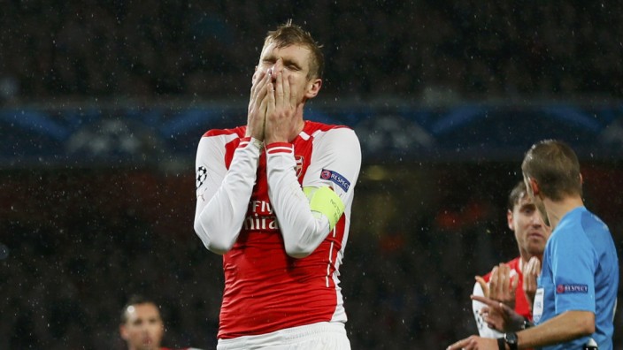 Arsenal's Mertesacker reacts after their Champions League soccer match against Anderlecht at the Emirates stadium in London