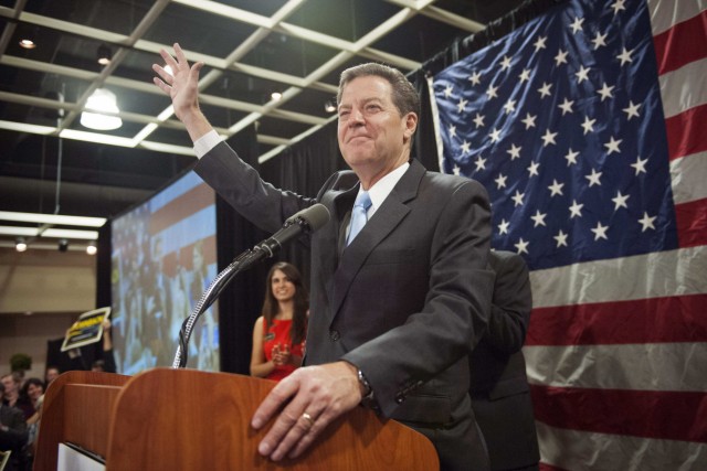 Republican Kansas Governor Brownback speaks to supporters after winning re-election in the U.S. midterm elections in Topeka
