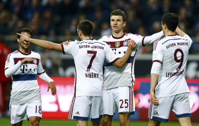 Bayern Munich's Mueller celebrates scoring second goal against Eintracht Frankfurt during Bundesliga soccer match in Frankfurt