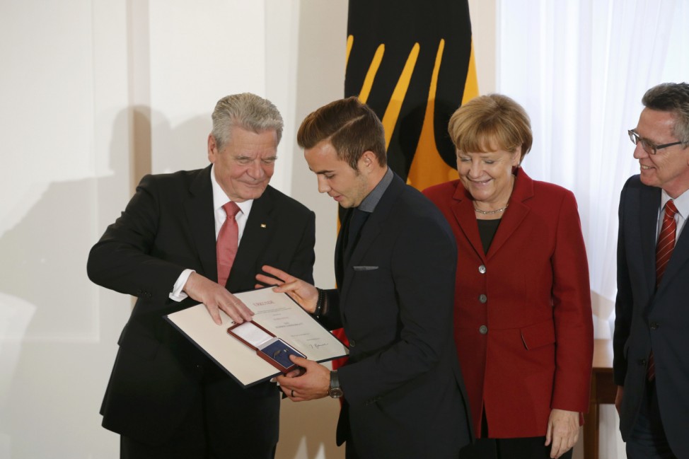 German President Gauck presents Silver Bay Laurel Leaf to German national soccer player Goetze in Berlin