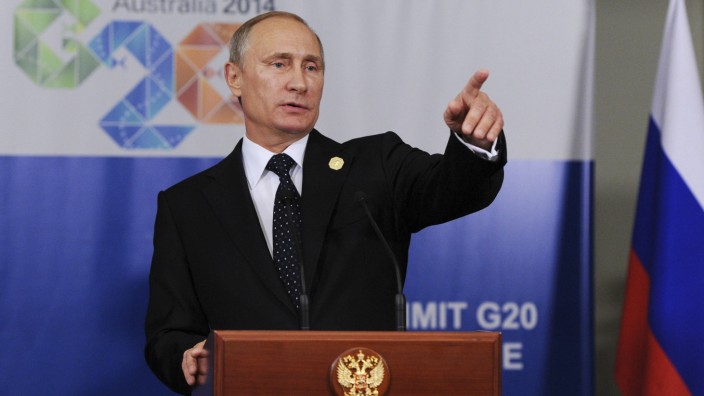 Russia's President Vladimir Putin speaks at a news conference at the end of the G20 summit in Brisbane