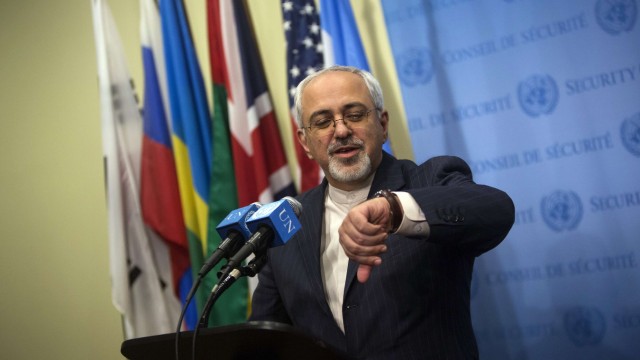 Iran's Foreign Minister Mohammad Javad Zarif looks at his watch at a news conference after a meeting at the U.N. headquarters in New York