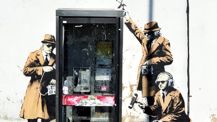 Apparent Banksy graffiti on surveillance surfaces