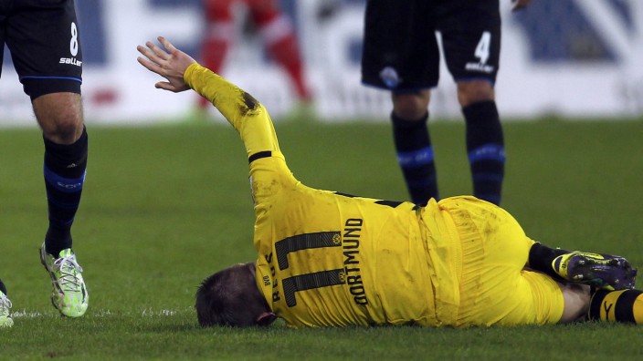 Borussia Dortmund's Reus reacts after an injury during the Bundesliga first division soccer match against Paderborn in Paderborn