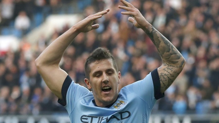 Manchester City's Stevan Jovetic celebrates after scoring a goal against Swansea City during their English Premier League soccer match at the Etihad stadium in Manchester