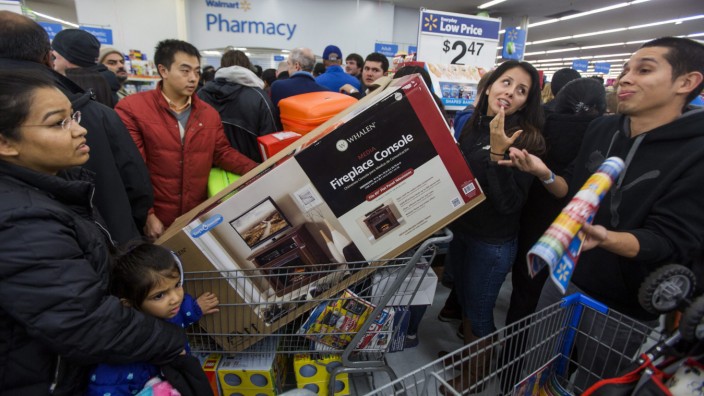 Black Friday Shoppers Line Up on Thanksgiving Day