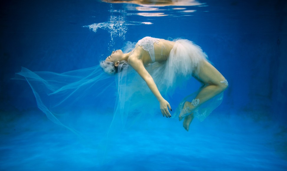 Leng Yuting, 26, posing underwater for her wedding pictures at a photo studio in Shanghai, ahead of her wedding next year.