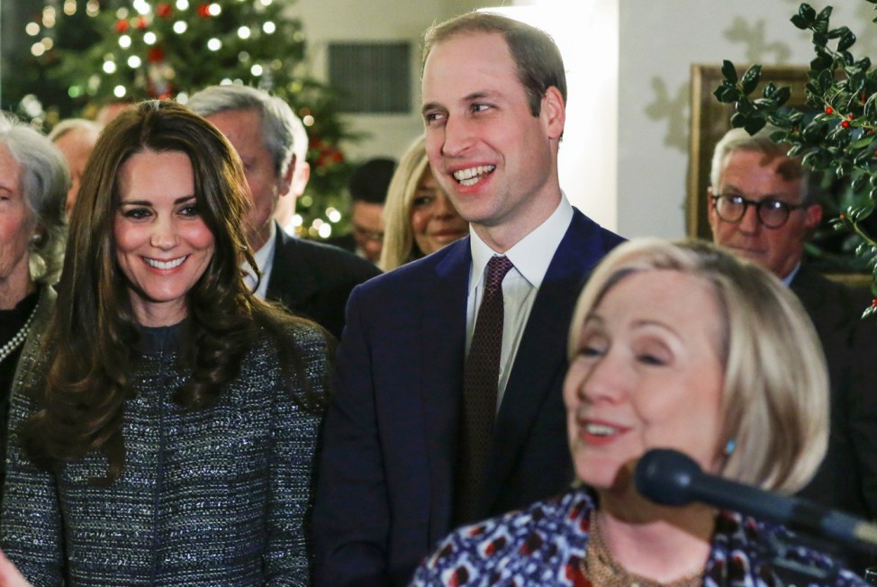 Britain's Prince William, Duke of Cambridge and his wife Catherine, Duchess of Cambridge smile while they listen to former U.S. Secretary of State Hillary Rodham Clinton in New York