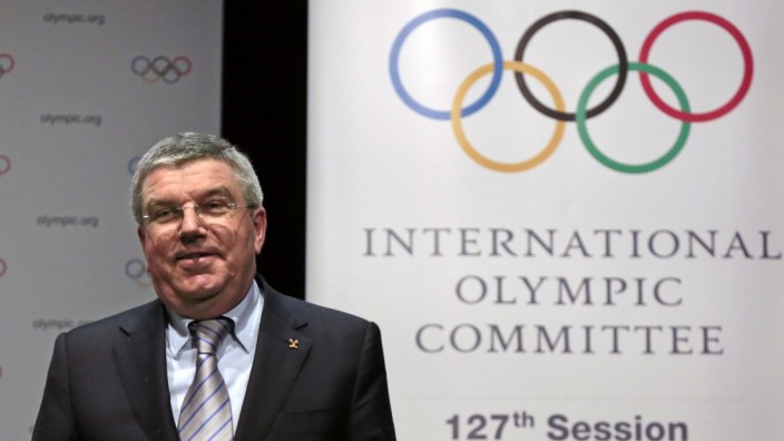 IOC President Bach smiles following a news conference as part of the IOC Executive Board meeting in Monaco