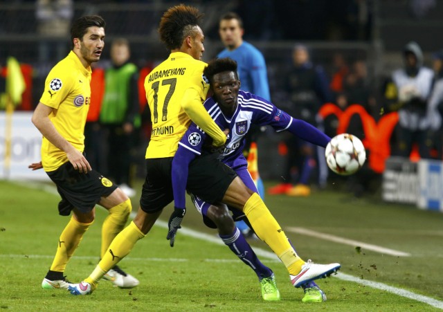 Borussia Dortmund's Aubameyang fights for the ball with Anderlecht's N'Sakala during their Champions League soccer match in Dortmund