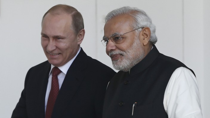 Russian President Putin and India's Prime Minister Modi arrives for a photo opportunity ahead of their meeting at Hyderabad House in New Delhi