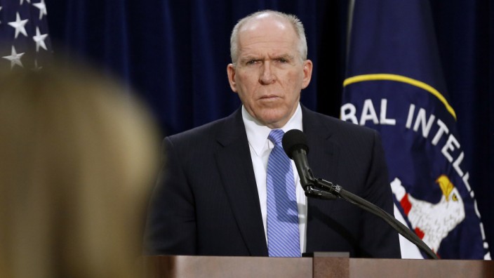 Director of the Central Intelligence Agency John Brennan listens to a reporter's question during a rare news conference at CIA Headquarters in Virginia