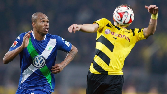 Borussia Dortmund's Immobile and VFL Wolfsburg's Naldo fight for the ball during their German first division Bundesliga soccer match in Dortmund