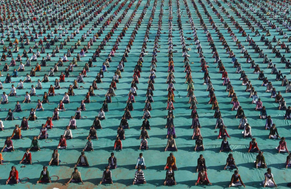 Schoolchildren attend a yoga session at a camp in Ahmedabad