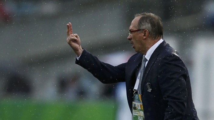 South Korea's coach Uli Stielike instructs his players during their Asian Cup Group A soccer match against Oman at the Canberra stadium in Canberra