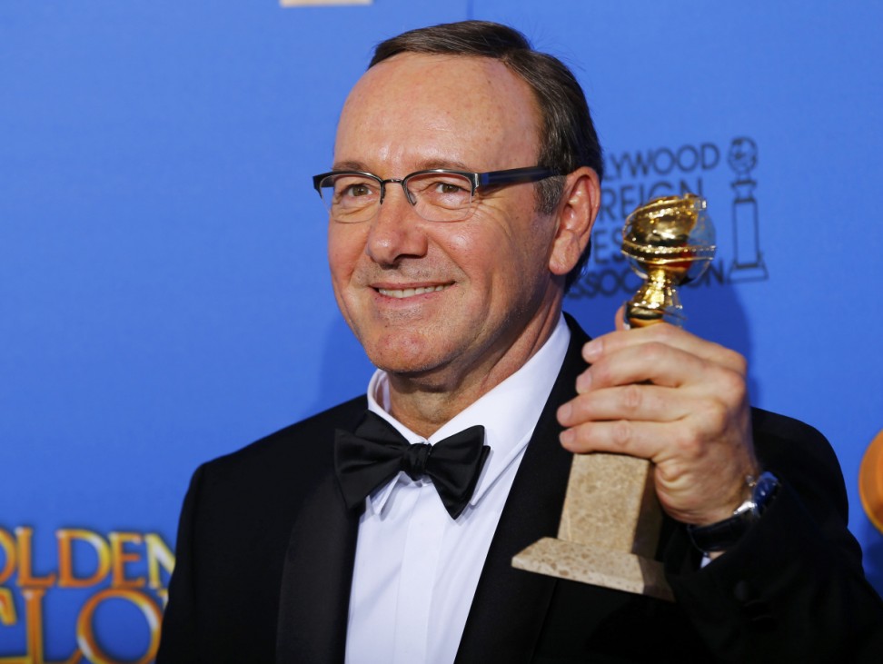 Actor Kevin Spacey poses backstage with his award for Best Performance by an Actor in a Television Series for 'House of Cards' at the 72nd Golden Globe Awards in Beverly Hills