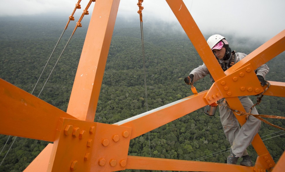 A worker paints the Amazon Tall Tower Observatory (ATTO) in Sao Sebastiao do Uatuma