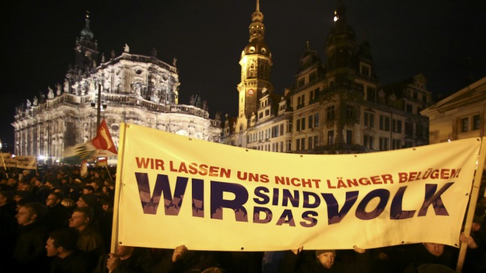 File photo of participants holding a banner during a demonstration called by anti-immigration group PEGIDA