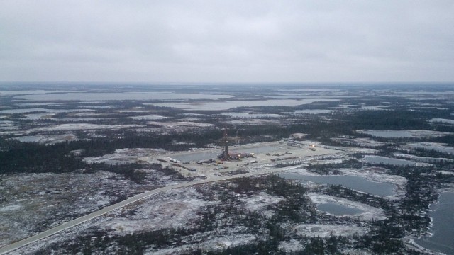 An aerial view shows an oil derrick and other facilities of an oilfield, part of the Imilorskoye group of fields, near the town of Kogalym