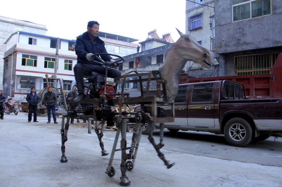 Su Daocheng rides his home-made mechanic horse vehicle on a street in Shiyan