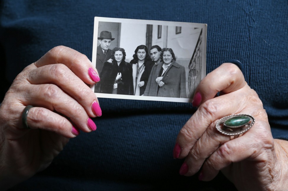 Auschwitz death camp survivor Erzsebet Brodt holds a picture of her family, who were all killed in the concentration camp during World War Two
