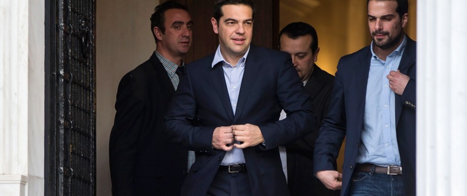 Newly appointed Greek Prime Minister and winner of the Greek parliamentary elections, Tsipras, walks with members of his cabinet in Athens