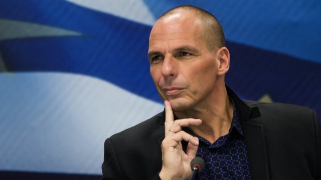 Newly appointed Greek Finance Minister Varoufakis attends a hand over ceremony in Athens