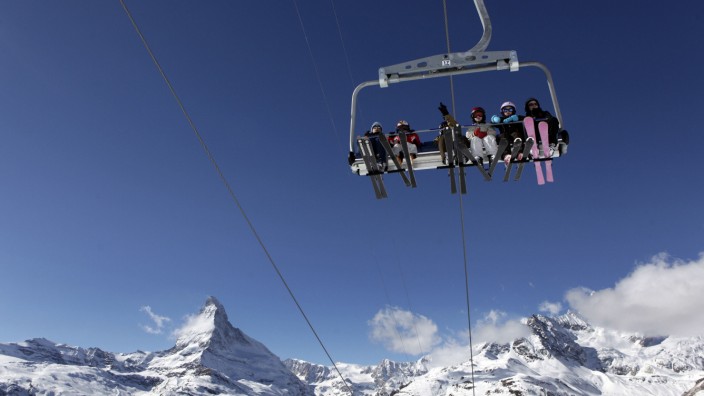 File photo of skiers pictured on a chair lift with Matterhorn mountain at Sunnegga in the ski resort of Zermatt