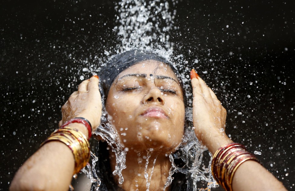 A Hindu devotee takes a ritual shower before starting her pilgrimage to the Batu Caves temple during Thaipusam in Kuala Lumpur
