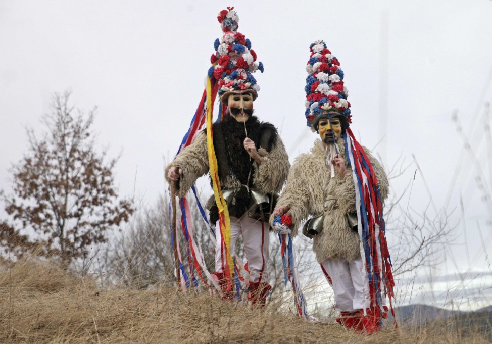 Members of the Hrusiski Skoromati Ethnological Society dressed as traditional native characters named 'Skoromati' pose ahead of the Carnival in Hrusica