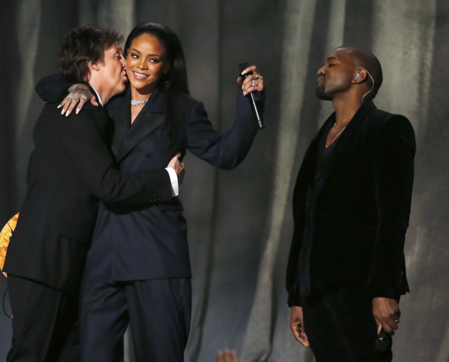 Paul McCartney kisses Rihanna as Kanye West watches after performing 'FourFiveSeconds' at the 57th annual Grammy Awards in Los Angeles
